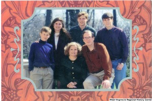 ["The 1992 Rockefeller family holiday card reads, \"May your holidays be filled with warmth and good cheer.\" Pictured are Jay, Sharon, Valerie, John, Justin, and Charles Rockefeller. On the back is an unofficial seal of the United States Senate."]%