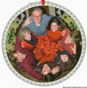 ["The 1997 Rockefeller family holiday card reads, \"We are so pleased to include you in our circle of family and friends in celebrating this very special time of year.\" Pictured are Jay, Sharon, Valerie, John, Emily, Charles, and Justin Rockefeller. On the back is an unofficial seal of the United States Senate. Photograph by Tracey Attlee LLC."]%