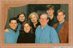 ["The 1999 Rockefeller family holiday card reads, \"Warmest wishes for a wonderful 1999 holiday season.\" Pictured are Jay, Sharon, Valerie, John, Emily, Justin, and Charles Rockefeller. On the back is an unofficial seal of the United States Senate. Photograph by Tracey Attlee LLC."]%