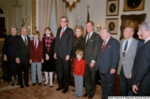 ["Senator John D. (Jay) Rockefeller is photographed with family, Senate colleagues Robert C. Byrd, Strom Thurmond, and Jennings Randolph, and Vice President George H. W. Bush after taking the oath of office at the Senate swearing-in ceremony."]%