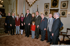 ["Senator John D. (Jay) Rockefeller stands with family and colleagues after being sworn into office."]%