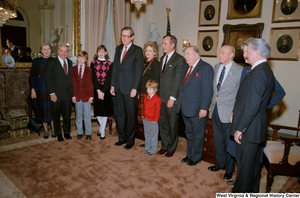 ["Colleagues including Senators Robert C. Byrd, Strom Thurmond, and Jennings Randolph, Vice President George H. W. Bush, and family surround Senator John D. (Jay) Rockefeller at the Senate swearing-in ceremony. (wider angle image)"]%