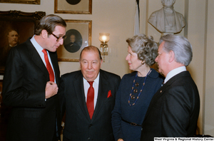 ["Following the Senate Swearing-In Ceremony, Senator John D. (Jay) Rockefeller speaks with former Senator Jennings Randolph and Senator Robert C. Byrd."]%