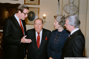 ["Senator John D. (Jay) Rockefeller speaks with Senate colleagues after the Senate Swearing-In Ceremony."]%