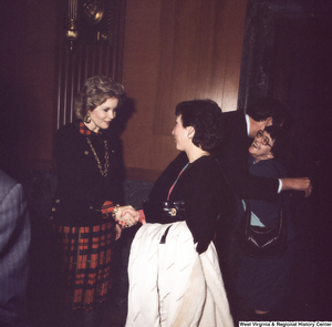 ["Senator John D. (Jay) Rockefeller and his wife Sharon greet unidentified individuals following the Senate Swearing-In Ceremony."]%