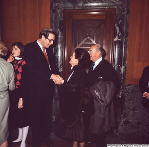 ["Senator John D. (Jay) Rockefeller speaks with unidentified supporters following the Senate Swearing-In Ceremony."]%