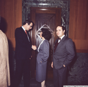 ["Senator John D. (Jay) Rockefeller shakes hands with unidentified individuals after the Senate Swearing-In Ceremony."]%