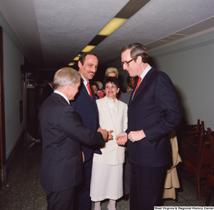 ["Senator John D. (Jay) Rockefeller speaks with unidentified supporters following his Senate Swearing-In Ceremony."]%