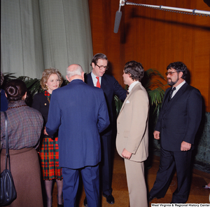 ["Senator John D. (Jay) Rockefeller and Sharon Rockefeller speak with unidentified supporters after the Senate Swearing-In Ceremony."]%