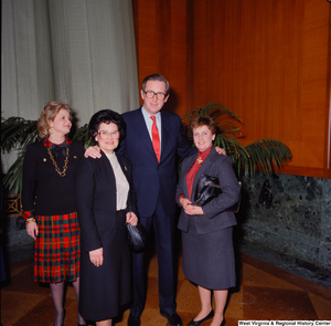 ["Senator John D. (Jay) Rockefeller, Sharon Rockefeller, and two unidentified supporters pose for a photograph at the Senate Swearing-In Ceremony."]%