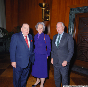 ["Former Senator from West Virginia Jennings Randolph stands with two unidentified individuals at the Senate Swearing-In Ceremony of Senator John D. (Jay) Rockefeller."]%