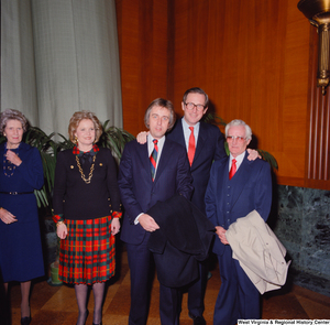 ["Senator John D. (Jay) Rockefeller poses with two unidentified individuals at the Senate Swearing-In Ceremony."]%