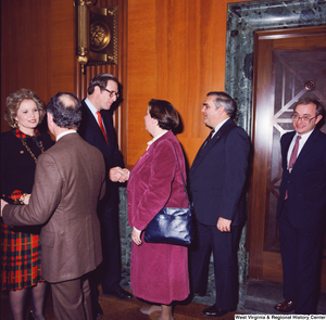 ["A group of unidentified supporters are greeted by Senator John D. (Jay) Rockefeller and his wife Sharon at the Senate Swearing-In Ceremony."]%