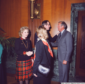 ["Sharon Rockefeller and Senator John D. (Jay) Rockefeller greet two unidentified supporters at the Senate Swearing-In Ceremony."]%