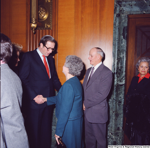 ["An unidentified supporter shakes hands with Senator John D. (Jay) Rockefeller at the Senate Swearing-In Ceremony."]%