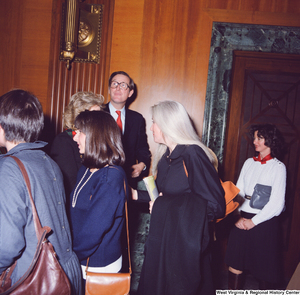 ["Senator John D. (Jay) Rockefeller and his wife Sharon are greeted by a crowd of unidentified supporters following the Senate Swearing-In Ceremony."]%