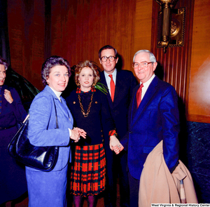 ["Senator John D. Rockefeller, his wife Sharon, and two unidentified supporters pose for a photograph at the Senate Swearing-In Ceremony."]%