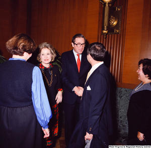 ["After he is sworn into office, Senator John D. (Jay) Rockefeller and his wife Sharon greet and shake hands with unidentified supporters."]%