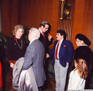 ["Senator John D. (Jay) Rockefeller shakes hands with an unidentified supporter while his wife Sharon talks with another following the Senate Swearing-In Ceremony."]%