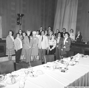 ["A group of National Association of Postmasters of the United States (NAPUS) members gather for a photograph at an event at the Senate."]%