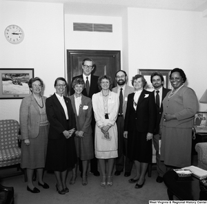 ["Senator John D. (Jay) Rockefeller stands for a photograph with an unidentified group in his Washington office."]%