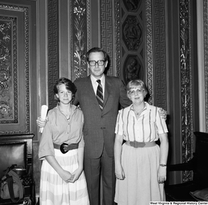 ["Senator John D. (Jay) Rockefeller greets two unidentified visitors in Washington."]%