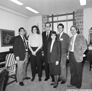 ["Senator John D. (Jay) Rockefeller stands in his office for a photograph with an unidentified group."]%