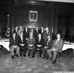 ["The group attending the West Virginia University Alumni Association event in Washington, including Congressman Nick Rahall, Senator John D. (Jay) Rockefeller, WVU President Neil S. Bucklew, and Senator Robert C. Byrd, gather for a photograph."]%