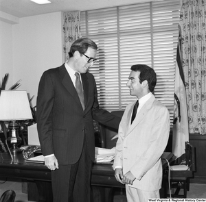 ["Senator John D. (Jay) Rockefeller speaks with an unidentified student in his Washington office."]%