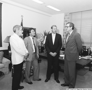 ["Senator John D. (Jay) Rockefeller speaks with three West Virginians about possible changes in Medicare regulation and how they would affect West Virginia hospitals."]%