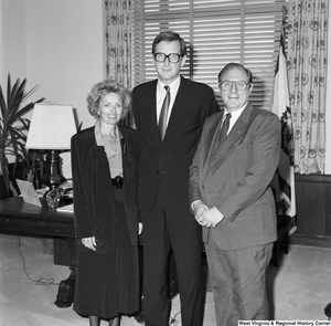 ["Senator John D. (Jay) Rockefeller stands in his office with two representatives from West Virginia schools."]%