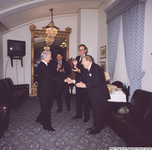 ["Senators John D. (Jay) Rockefeller and Al Gore and former Senator Jennings Randolph greet Senator Robert C. Byrd on his birthday."]%