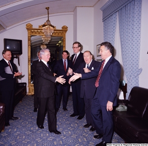 ["Photograph of Senator Robert C. Byrd greeting colleagues at a celebration for his birthday."]%