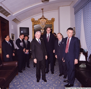 ["Senators Robert C. Byrd and John D. (Jay) Rockefeller stand with Senate colleagues during a celebration of Senator Byrd's birthday."]%