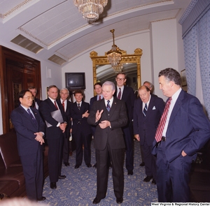 ["Senator Robert C. Byrd speaks to the group of Senate colleagues that have gathered to celebrate his birthday."]%