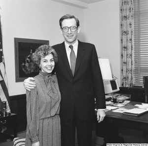 ["Senator John D. (Jay) Rockefeller stands with an unidentified woman for a photograph in his office."]%