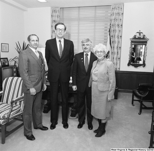 ["Senator John D. (Jay) Rockefeller and three representatives from the Education School Budget Group stand for a photograph beside a chair in his office."]%