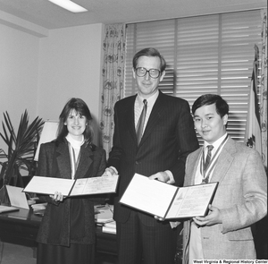 ["Senator John D. (Jay) Rockefeller stands with the two West Virginia delegates to the 1987 United States Senate Youth Program. This prestigious program and the scholarship associated with it are run by the Hearst Foundations and give two high school students per state, per year the opportunity to attend a week-long Washington program that fosters experience-based knowledge of the Senate and federal government and promotes public service and leadership."]%