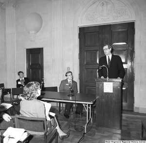 ["Senator John D. (Jay) Rockefeller speaks at a small unknown event in one of the Senate buildings."]%