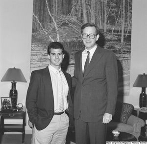 ["Senator John D. (Jay) Rockefeller stands next to an unidentified young man in his office."]%