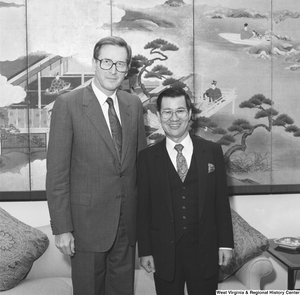 ["Senator John D. (Jay) Rockefeller stands next to an unidentified man in his office."]%