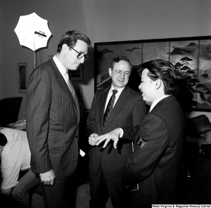 ["Senator John D. (Jay) Rockefeller listens as a representative of China Steel speaks."]%