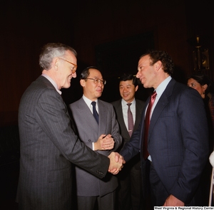 ["Senator John D. (Jay) Rockefeller's staff members stand with Congressman Bob Wise during an event in the Senate."]%