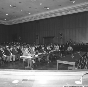 ["This photograph shows the audience at a committee hearing at the Senate."]%