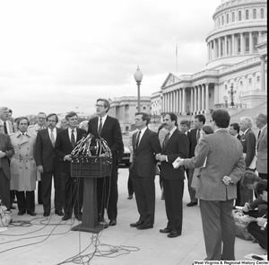 ["Senator John D. (Jay) Rockefeller speaks at an alternative motor fuels event outside the Senate."]%