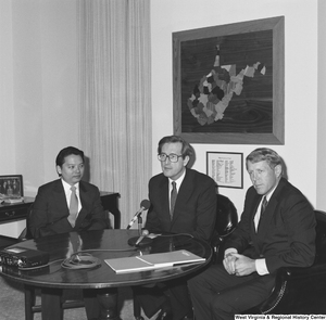 ["Senator John D. (Jay) Rockefeller sits with a representative from the US Steel Mining Company."]%