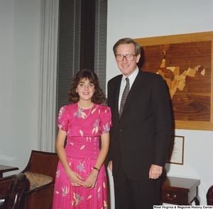 ["Senator John D. (Jay) Rockefeller stands next to an unidentified young man."]%