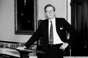 ["Senator John D. (Jay) Rockefeller leans against his lectern after giving a speech to a group of people in one of the Senate rooms."]%