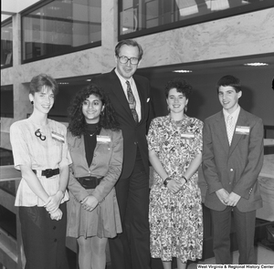 ["Senator John D. (Jay) Rockefeller stands with four participants in the Washington Workshops program."]%