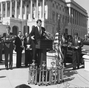 ["Senator Al Gore speaks at a clean vehicle event outside the Senate."]%